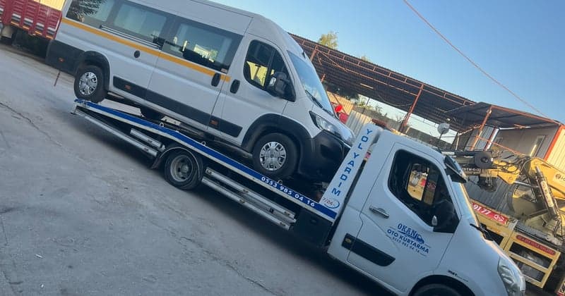 Minibus transport on a flatbed tow truck in Bursa
