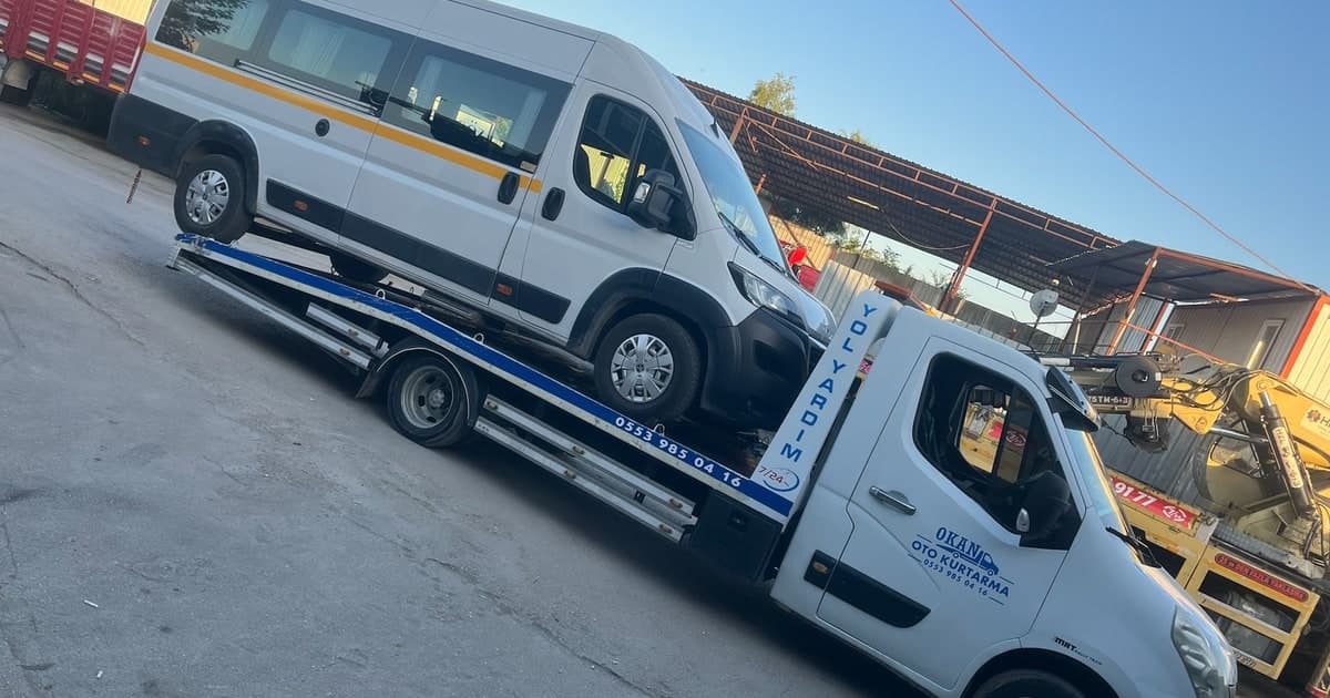 Minibus transport on a flatbed tow truck in Bursa