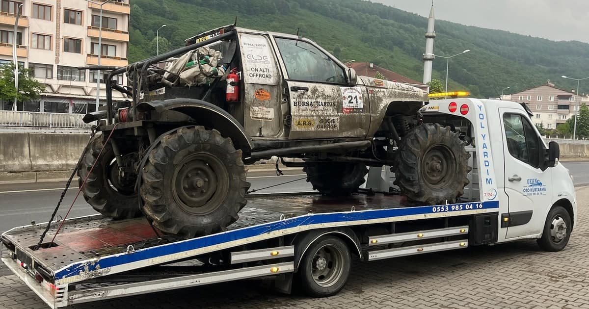 Mud-covered 4x4 recovery on a tow truck in Yıldırım
